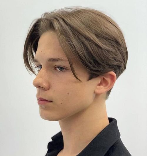 Medium-length curtain hairstyle parted near the centre