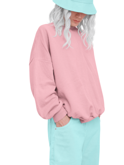 Woman wearing a pink hooded top with pale trousers