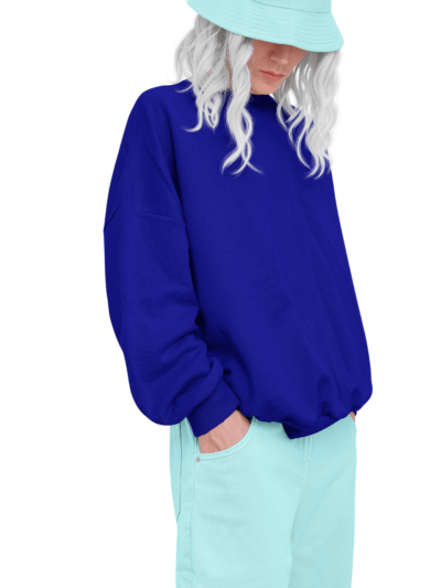 Woman wearing a blue hooded top with pale trousers