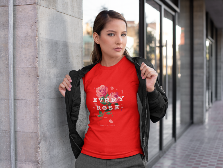 Woman showing a red graphic T-shirt beneath a black jacket