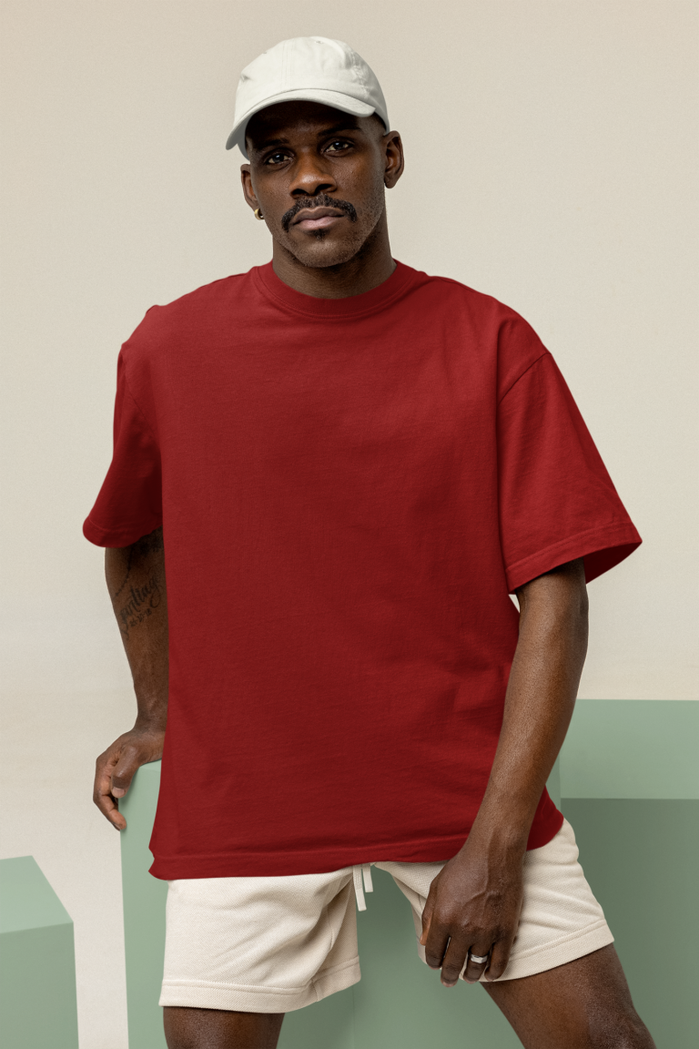 Relaxed maroon T-shirt paired with light shorts