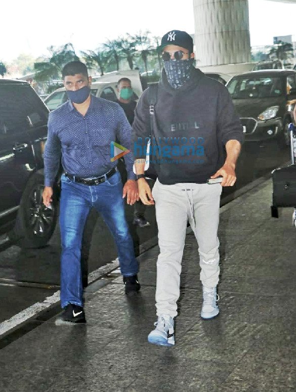 Ranbir Kapoor — Dark hoodie, light trousers and cap