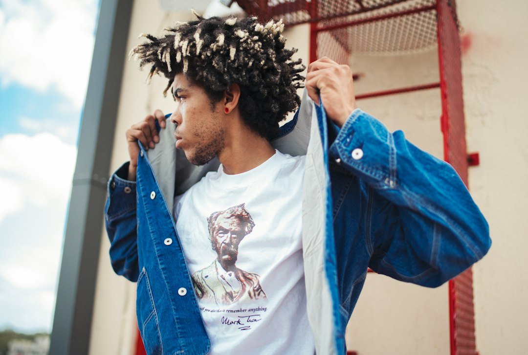 Blue outer layer worn open around a white printed tee