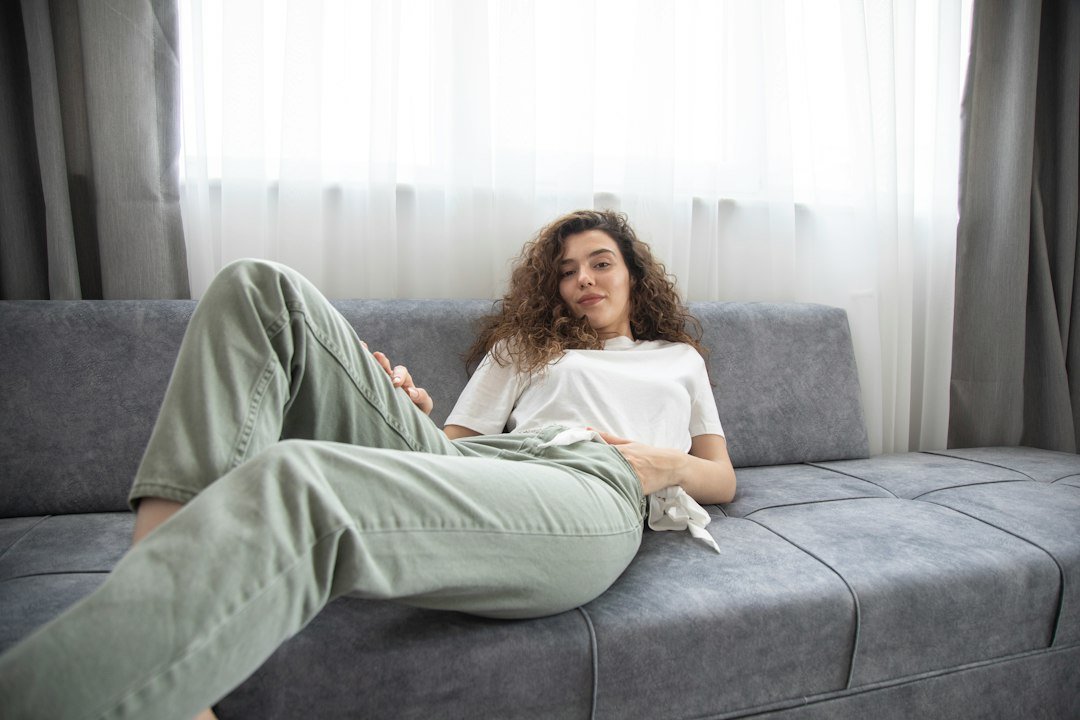 Loose sage-green trousers paired with a white T-shirt